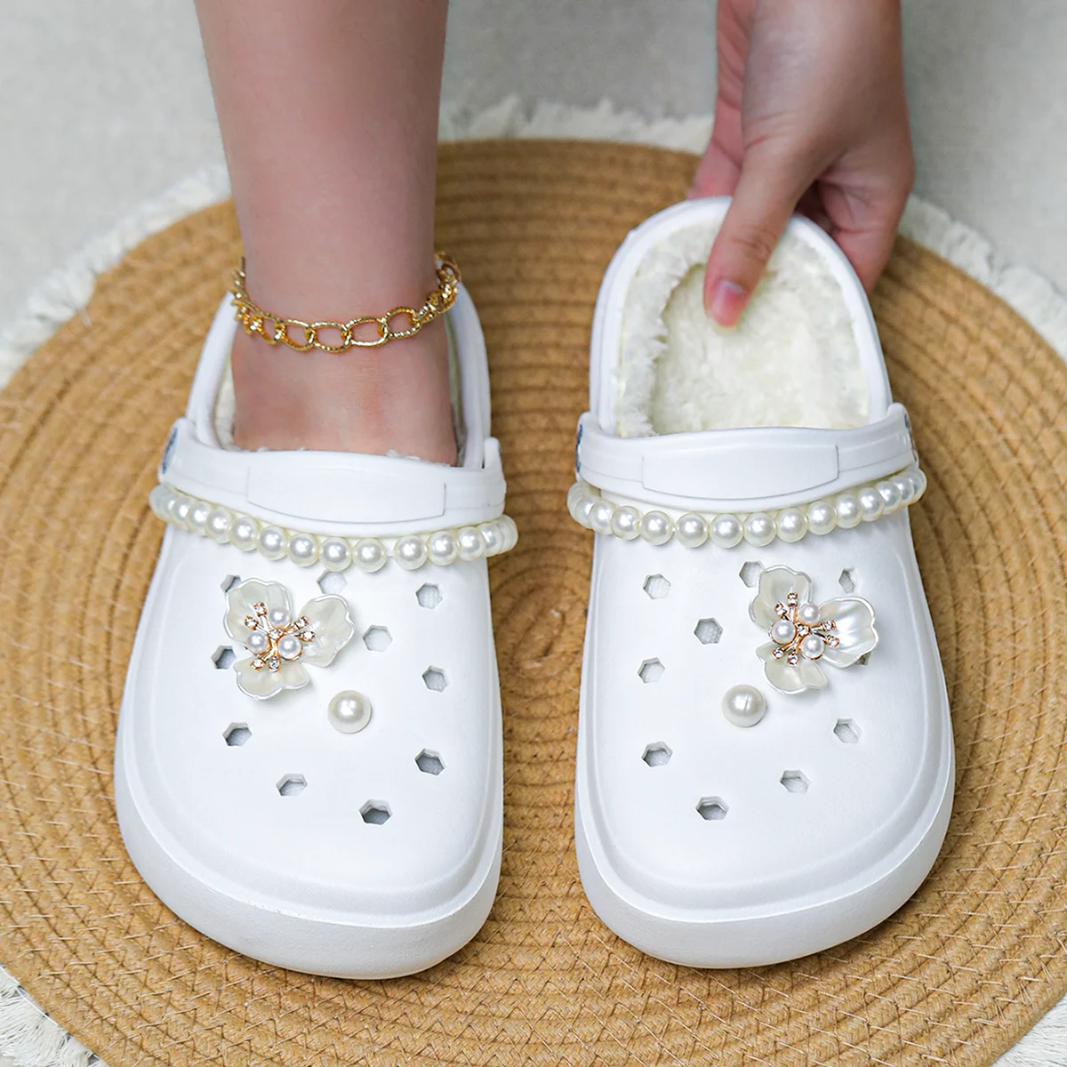 A pair of stylish women's winter slippers with fleece lining for warmth and comfort, a perfect gift for your friends