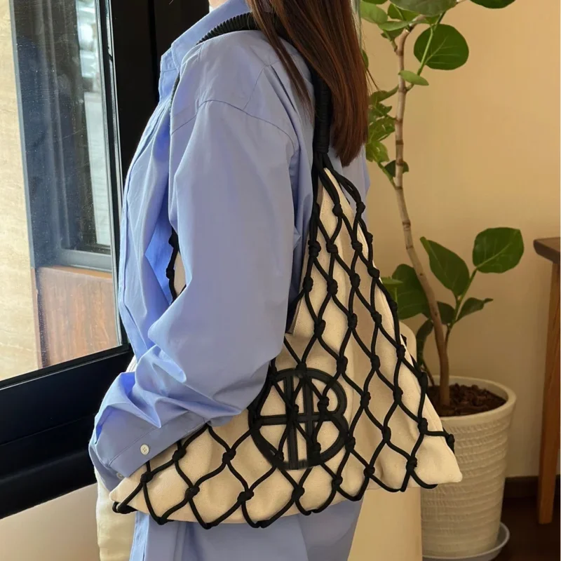 Aushöhlen gestaltete Umhängetasche England Stil lässig Frauen Leinwand Tasche Achsel Tasche