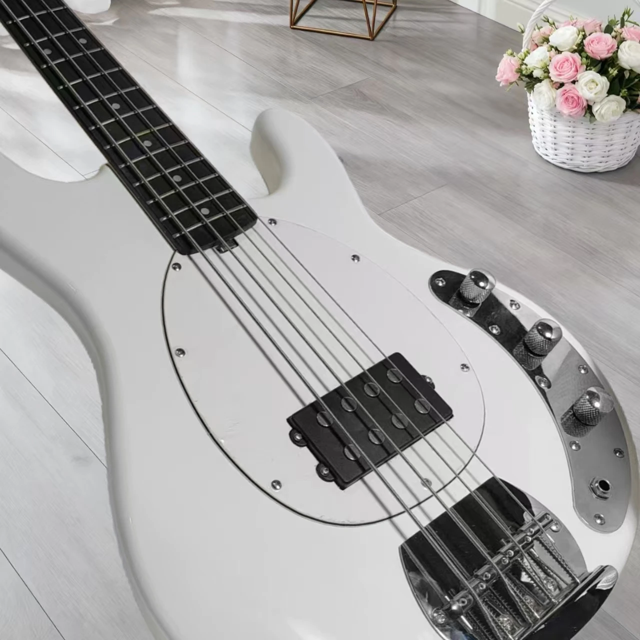 

High-quality white electric bass guitar, 4 strings, chrome hardware