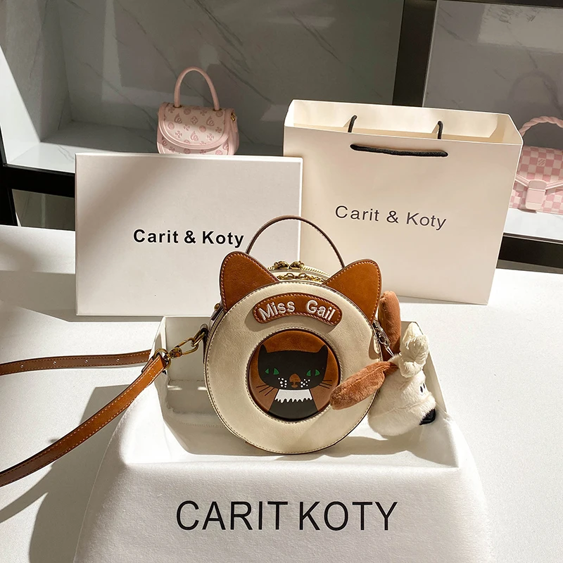 

2025 Round and Cute with Cat - Ear Decorations and a Cat Pattern Women’s Cross Body bag for Daily Use