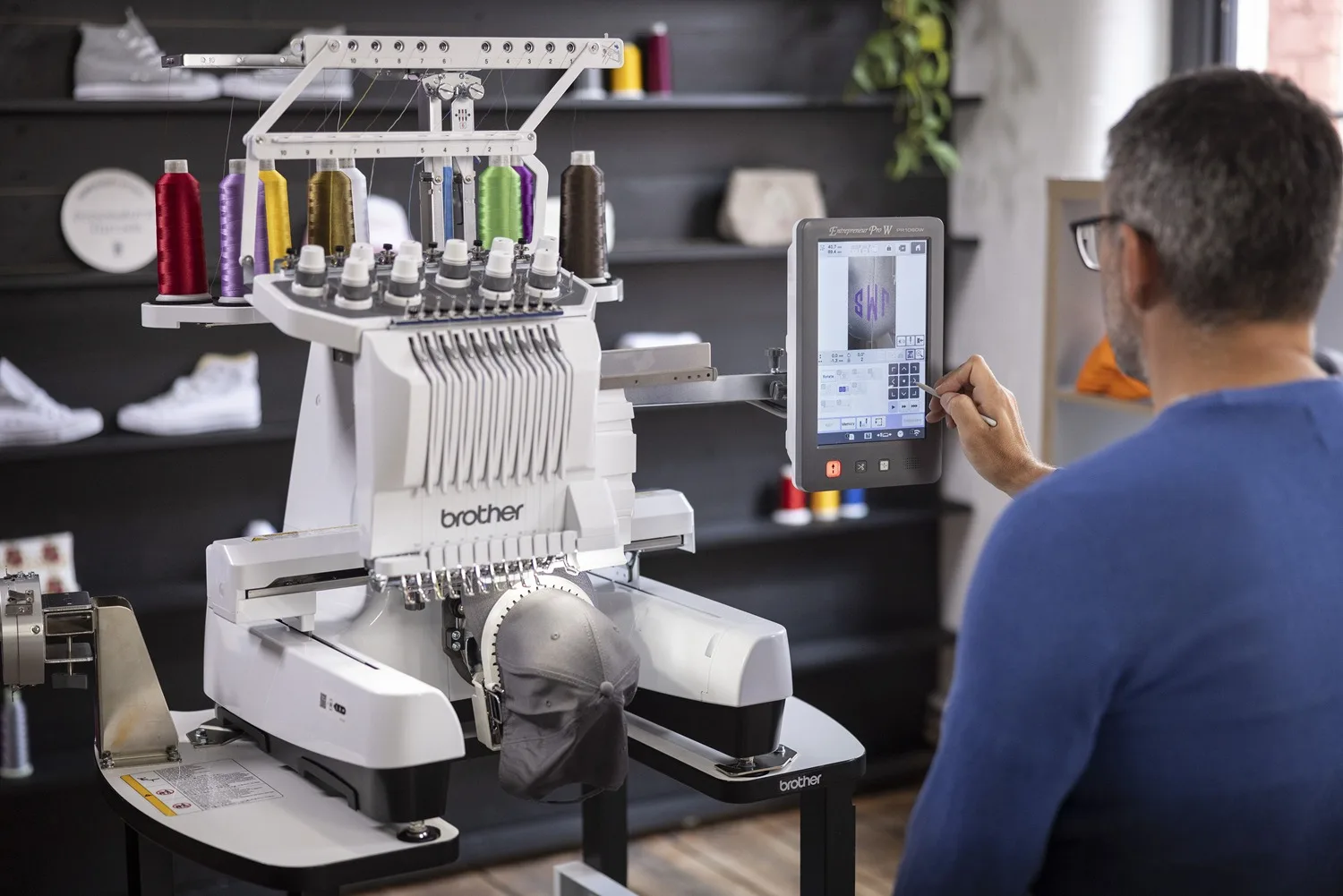 BRAND NEW next-gen production embroidery machine for hats and T-shirts now available for sale.