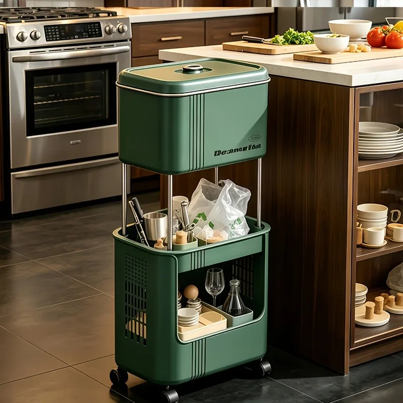 Two-tier wheeled kitchen trash cart with lid to prevent odors on the top bin and a ventilated open lower storage basket, 360° rotating mobile trash organizer cart, deep gray and dark green narrow space-saving design, suitable for cleaning supplies in kitc