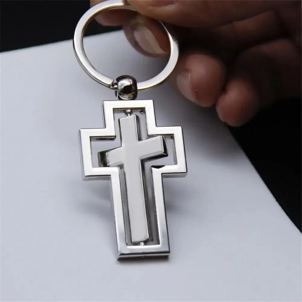 Porte-clés croix rotative en métal creux, porte-clés Jésus, porte-clés de voiture pour couple, pendentif de sac, fête de festival, cadeaux religieux, résistant à 360