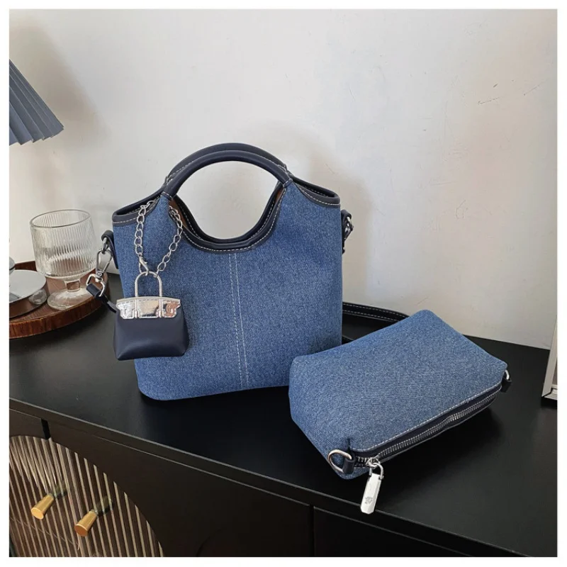

2026 Structured bucket crossbody bag with detachable strap & mini charm, sleek silhouette & versatile for all occasions