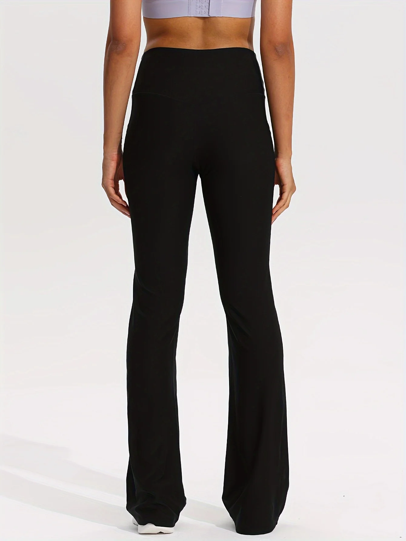 กางเกงโยคะสตรีเอวสูงสีดำ - ดีไซน์ทรงบานและมีกระเป๋า - เหมาะสำหรับเล่นกีฬาแบบสบาย ๆ ยืดได้