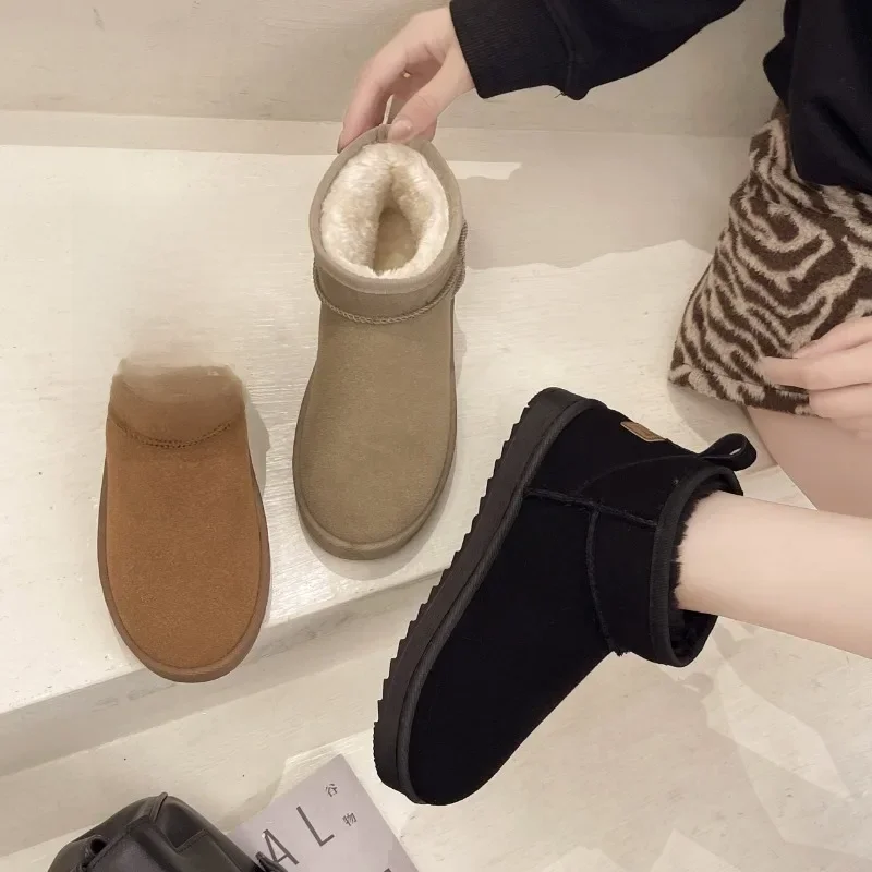 Bottines de neige courtes en peau de mouton pour femme, chaussures plates chaudes, imperméables, en laine naturelle, doublées de fourrure, nouvelle collection hiver