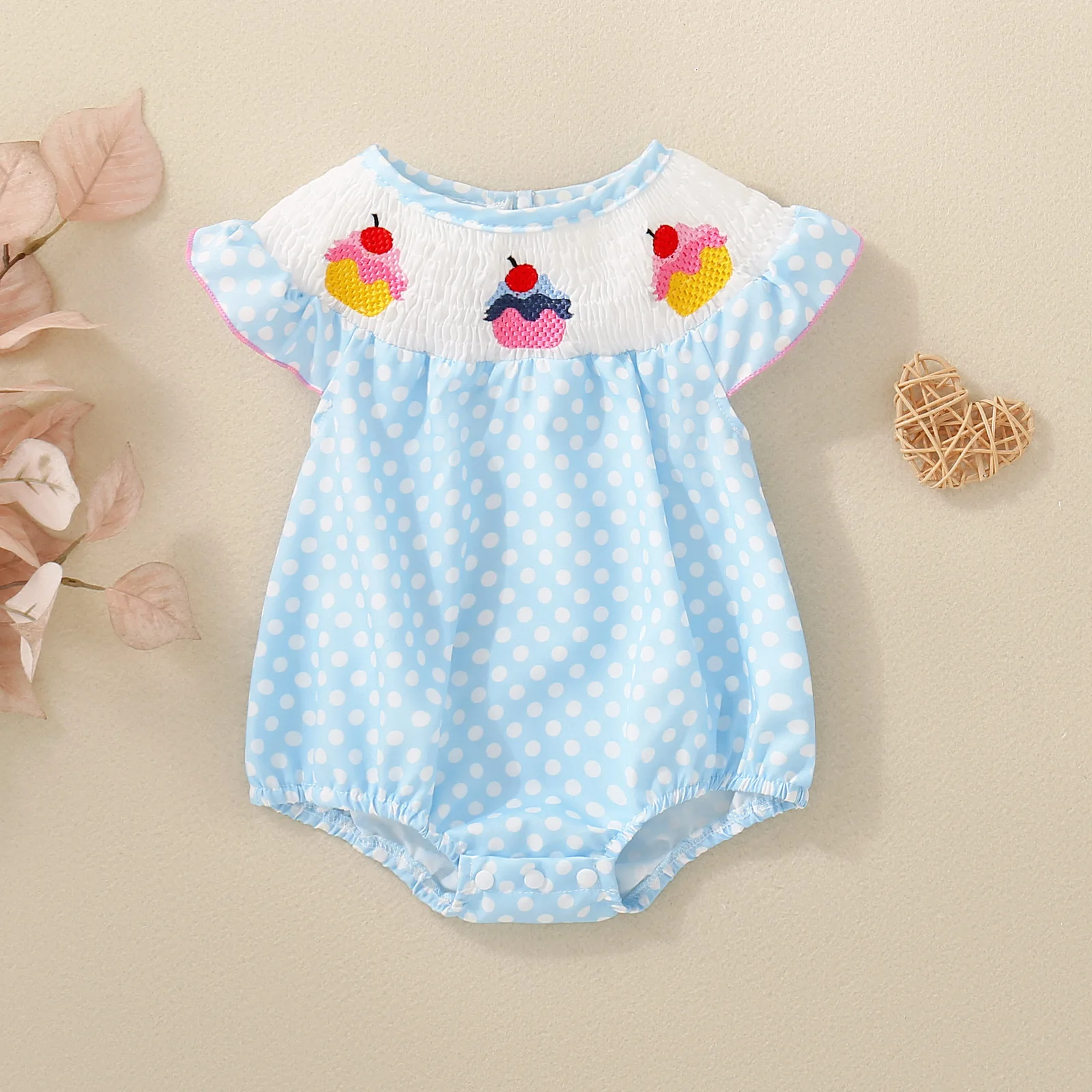 

Affordable Baby Dessert-Themed Bodysuit: Blue Polka Dot + Cupcake Embroidery – Ruffled Collar for Summer Fun.