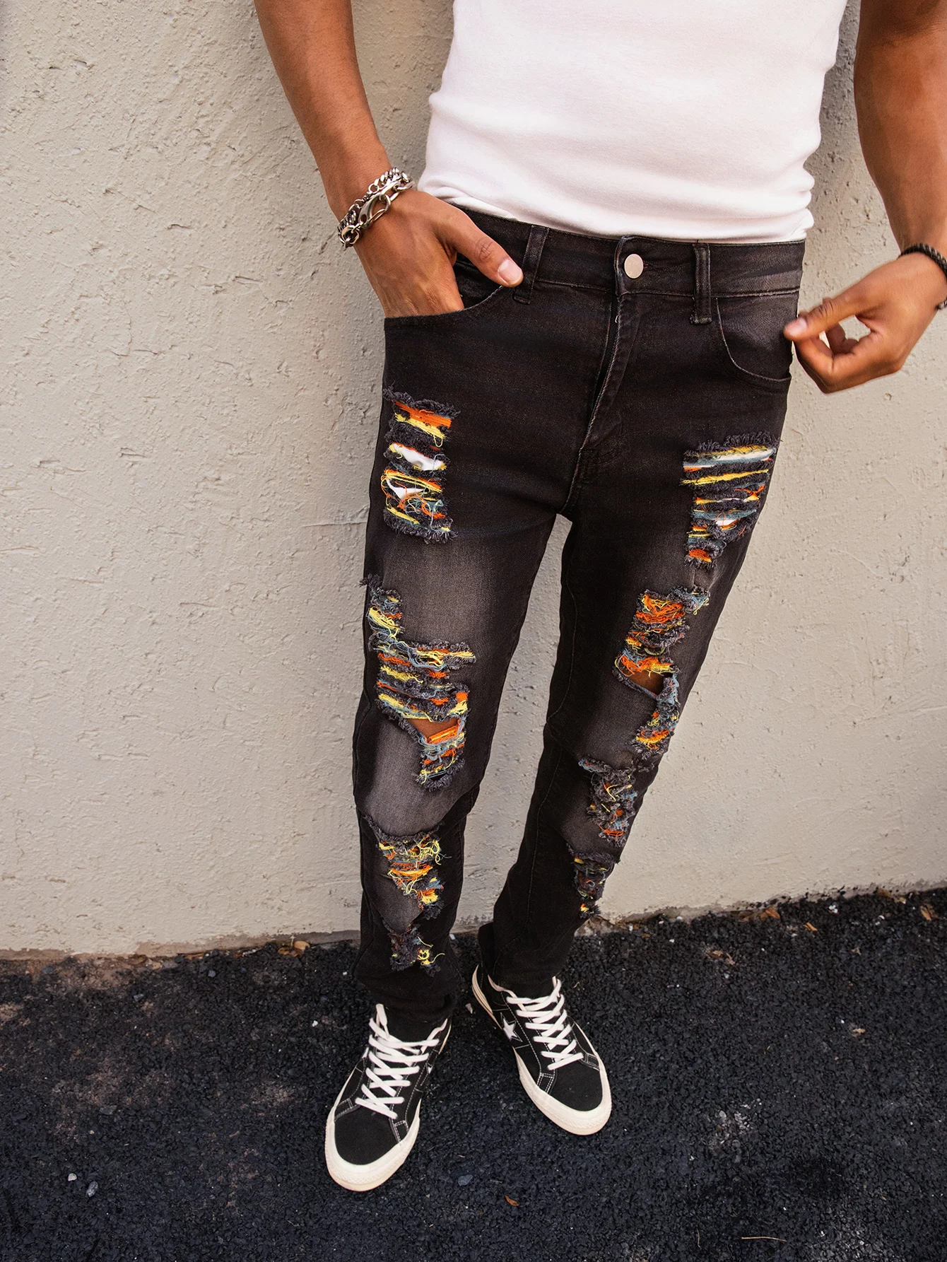 

Men's black jeans; multi-hole torn jeans; multi-color large hole jeans.
