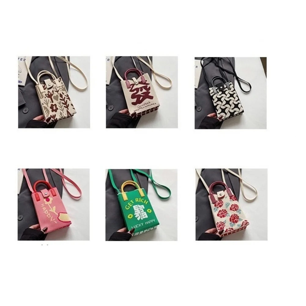 A spacious knitted small mobile wallet with a crossbody strap, suitable for women traveling with small items