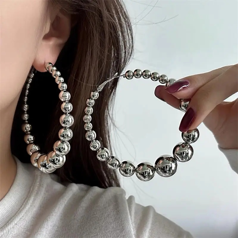 

Роскошные серебряные серьги-кольца из бисера