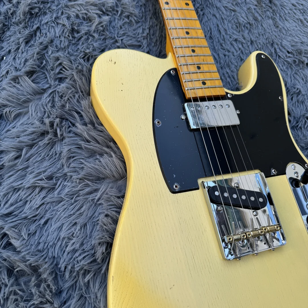 Cream yellow six-string classic electric guitar Maple neck wood grain basswood body Maple fingerboard Black guard can be custom