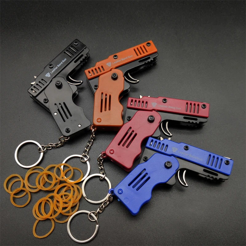 1PCS Mini Keychain Gun Rubber Band Gun Toy Shooting Pistol Alloy Rubber Band Pistol Kids Outdoor Party Folding Metal Gun Gifts