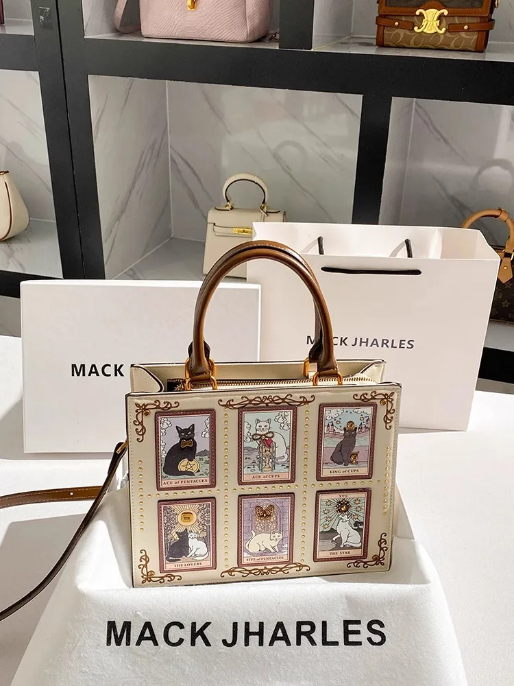 

Vintage and Luxury Handheld Tote Bag with Delicate Cartoon Cat Printing and Embroidery Women Popular and Fashion Handbag
