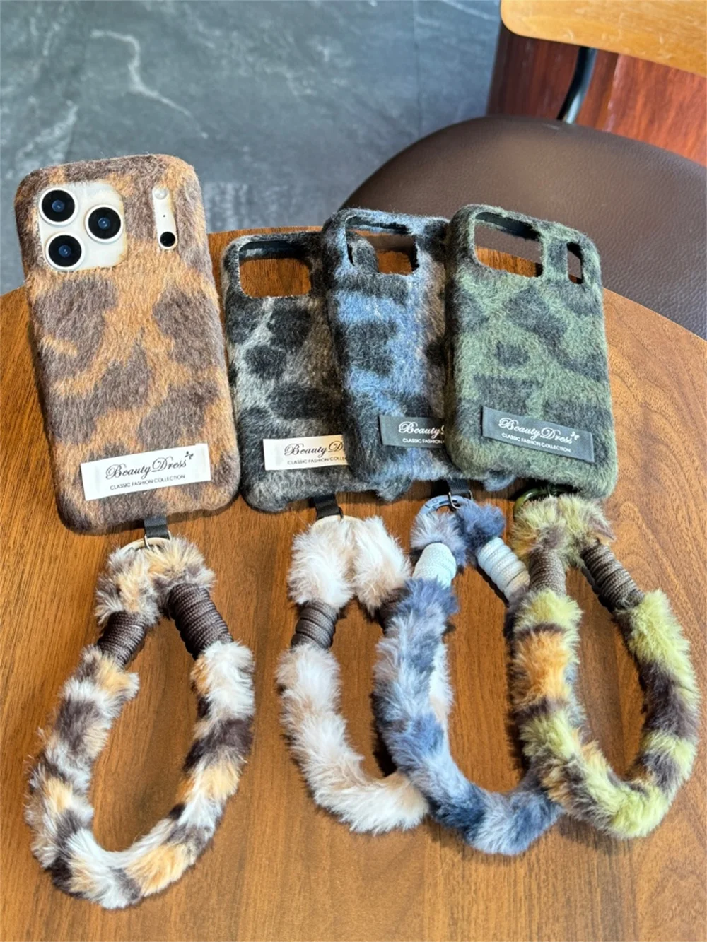 

New cute and luxurious winter leopard print phone case with rope suitable for iPhone 17/13/14/15/16 Pro Max, fully equipped with