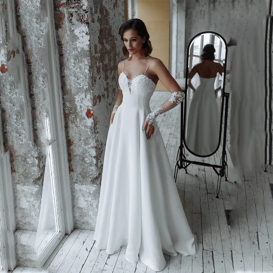 

Captivating Satin Wedding Dress with V-neckline And Spaghetti Straps Glamorous Sequin Applique Bridal Gown with Sweep Train