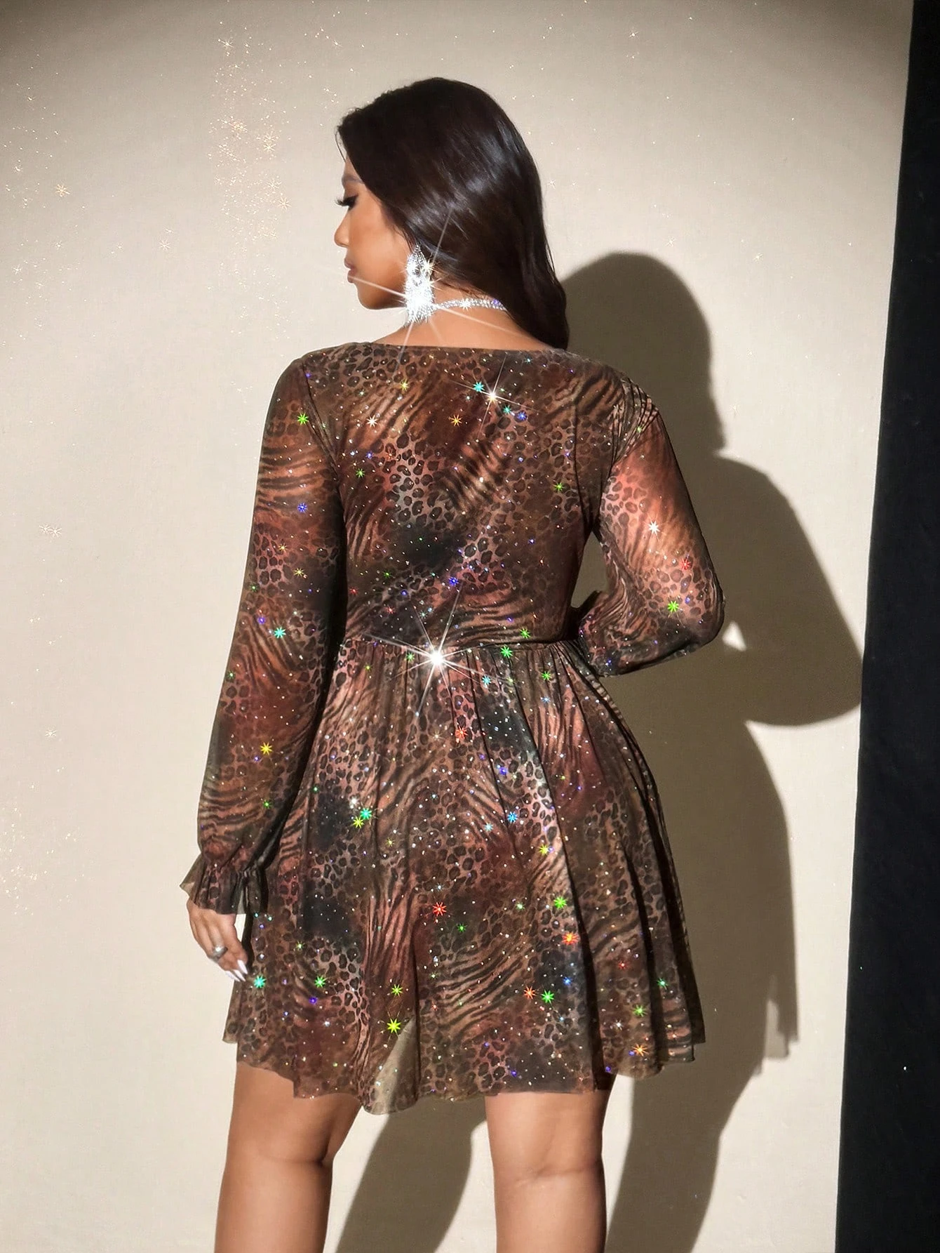Plus-size women's V-neck leopard print long-sleeved party mini dress, featuring a shimmering sheer skirt that's perfect for part