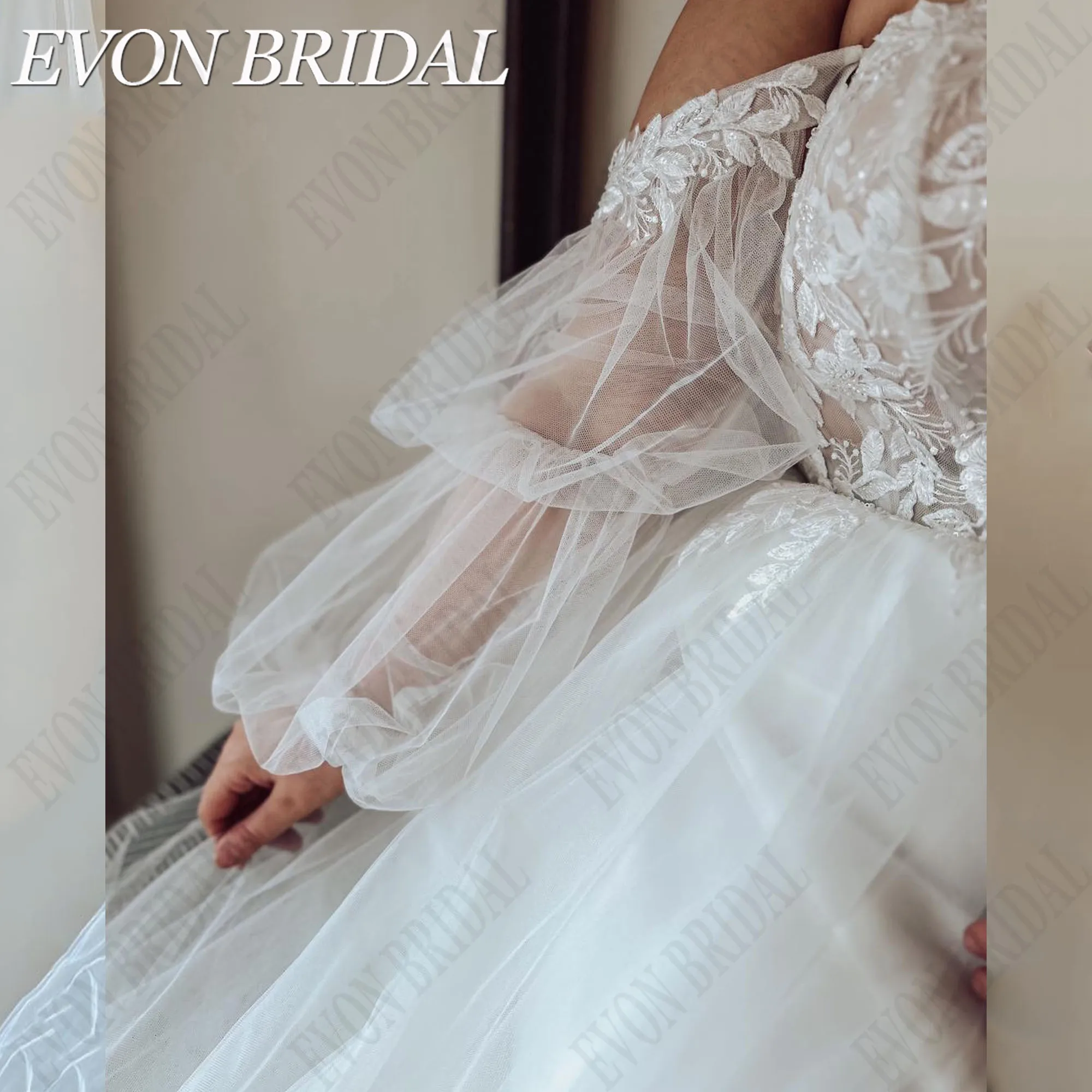 EVON BRIDAL strapless kant trouwjurk plus maat voor bruid pofmouwen A-lijn backless applique op maat gemaakte bruidsjurkenEVON BRIDAL Strapless Kant Bruidsjurk Plus Size Voor Bruid Puff Mouwen A-Lijn Backless Applique