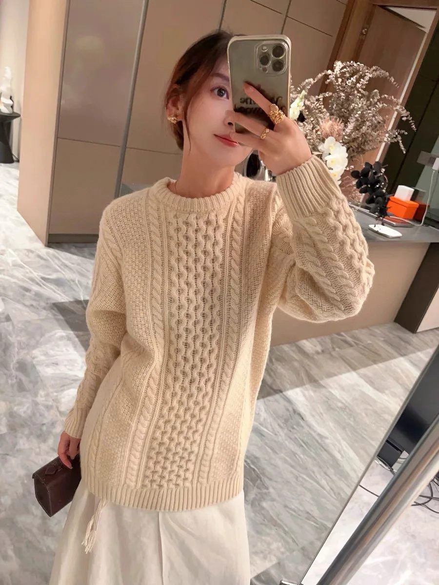 Exquisitely trimmed classic wool sweater of high quality