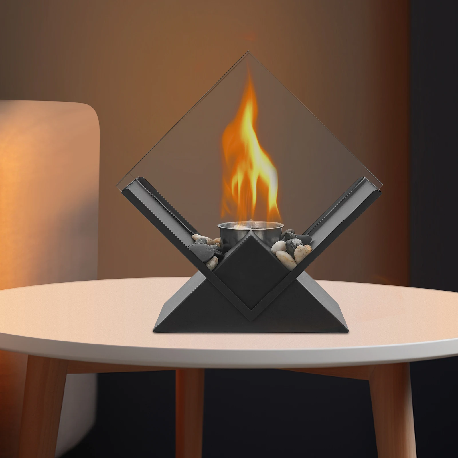 حفرة نار من الزجاج والمعدن الأسود مع أحجار زخرفية، مدفأة على الطاولة للاستخدام الداخلي أو الخارجي لطاولة الطعام، طاولة الحفلات