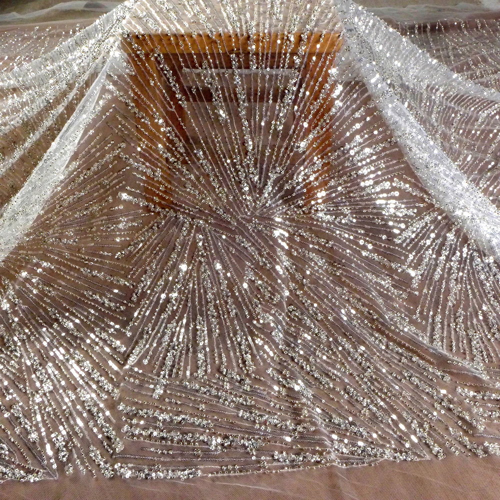 

HelluyerDc Silver beaded on ivory background lace fabric,oblique triangle for wedding prom dress fabric ,can be use as lining