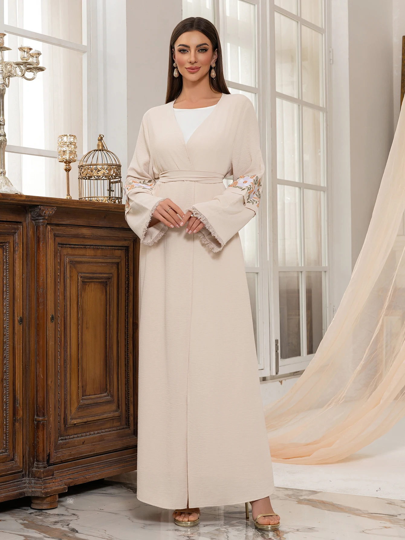 

Elegant Beige Muslim Abaya with Floral embroidered Sleeves Belted Design for Ramadan Eid Islamicand Formal Events in the Dubai