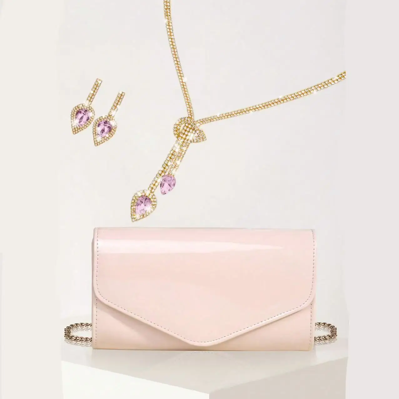 

A cute, small, charming and exquisite clutch commuter bag for women paired with a gorgeous jewelry set, perfect for gift giving.