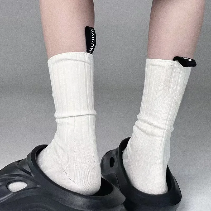 Dla mężczyzn Kobiety Jednolity kolor Moda styl Pięta etykieta Angielskie litery Bawełna Casual Middle Tube Para Skarpety Street Sport Hip Hop — zdjęcie 2
