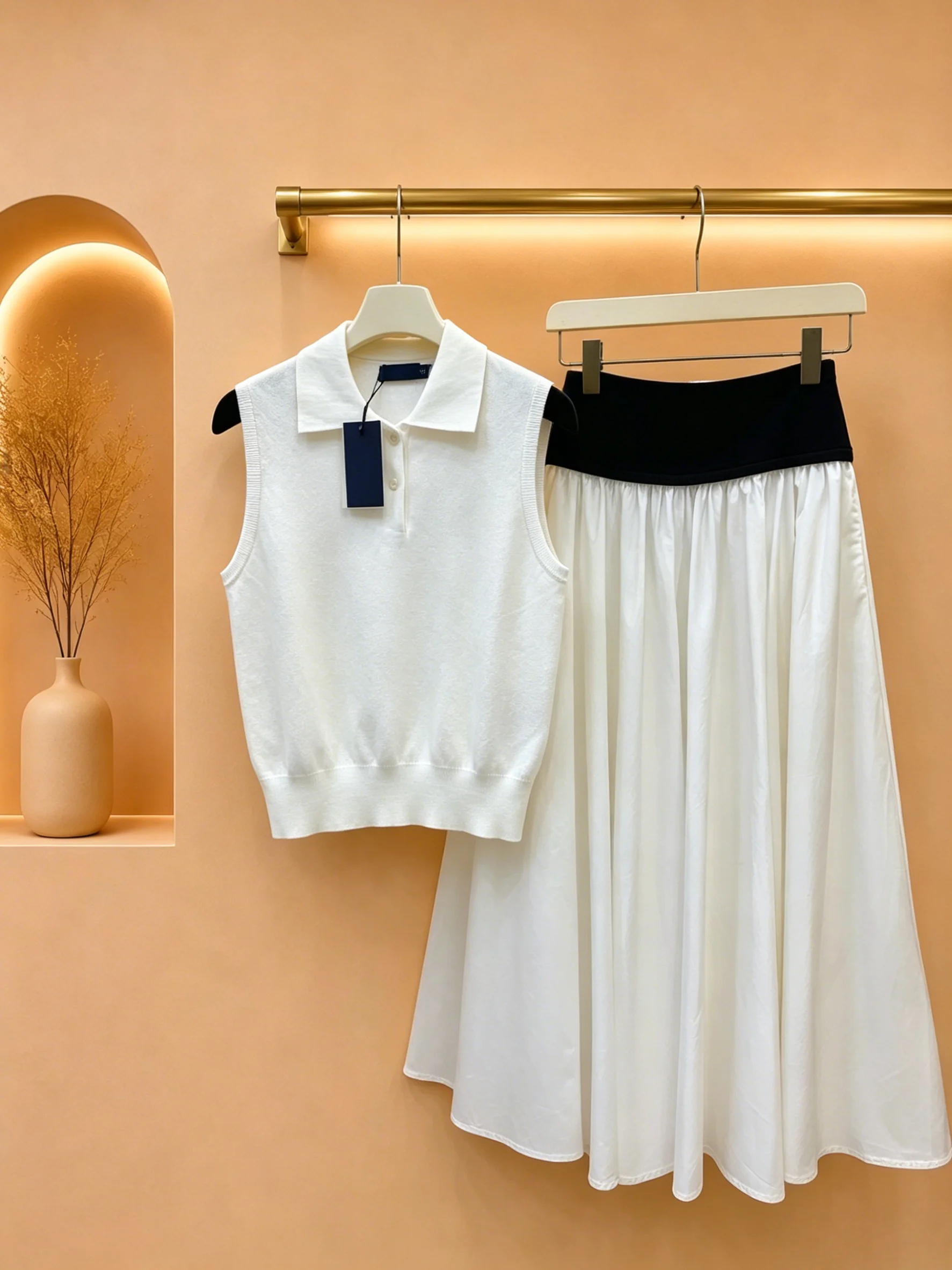 

2026 Women Two Piece Set Minimal Half Placket Sleeveless Knit Top Structured Contrast Waist Swing Skirt