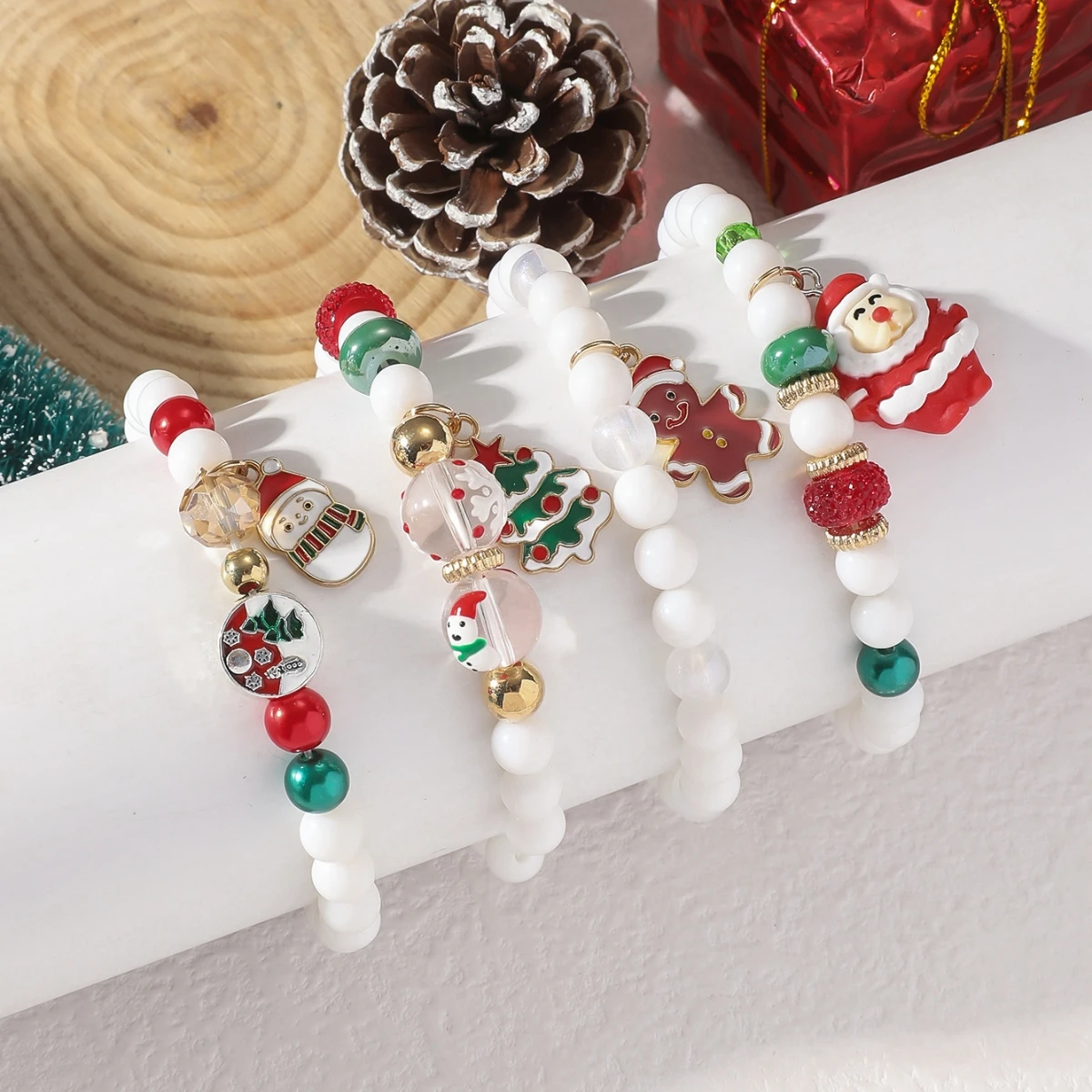 A set of 4 Bohemian style handmade bead Christmas bracelets with personalized fashionable creative Christmas snowman bracelets