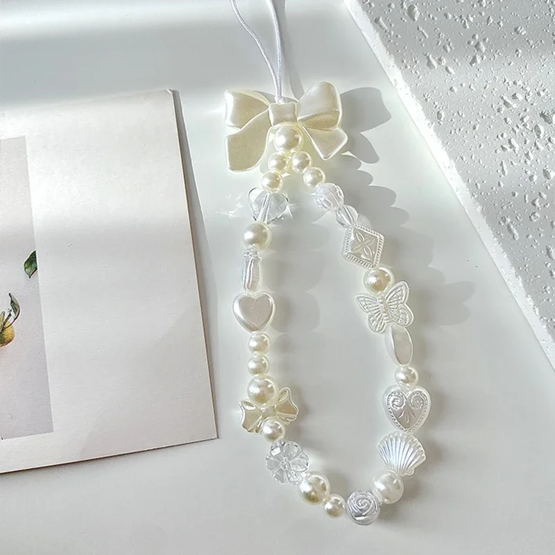 Coréen mignon doux papillon coeur arc perlé téléphone chaîne charme lanière pour iPhone Samsung accessoires universels bijoux pendentif