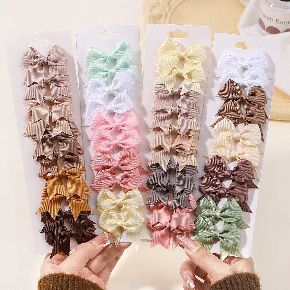 Pinces à cheveux avec nœuds pour bébé fille, 10 pièces/lot, ruban de couleur unie, épingle à cheveux à nœud papillon faite à la main, Mini Barrettes, accessoires pour cheveux d'enfants