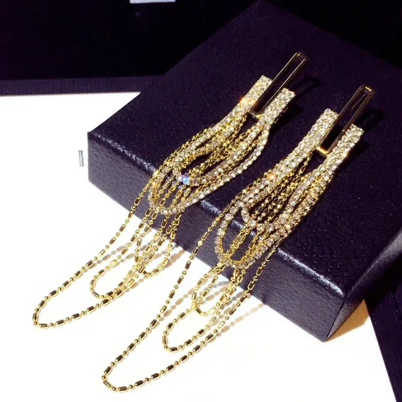 

GlamourLuxe Cascade – Gold Rhinestone Chain Dangle Earrings