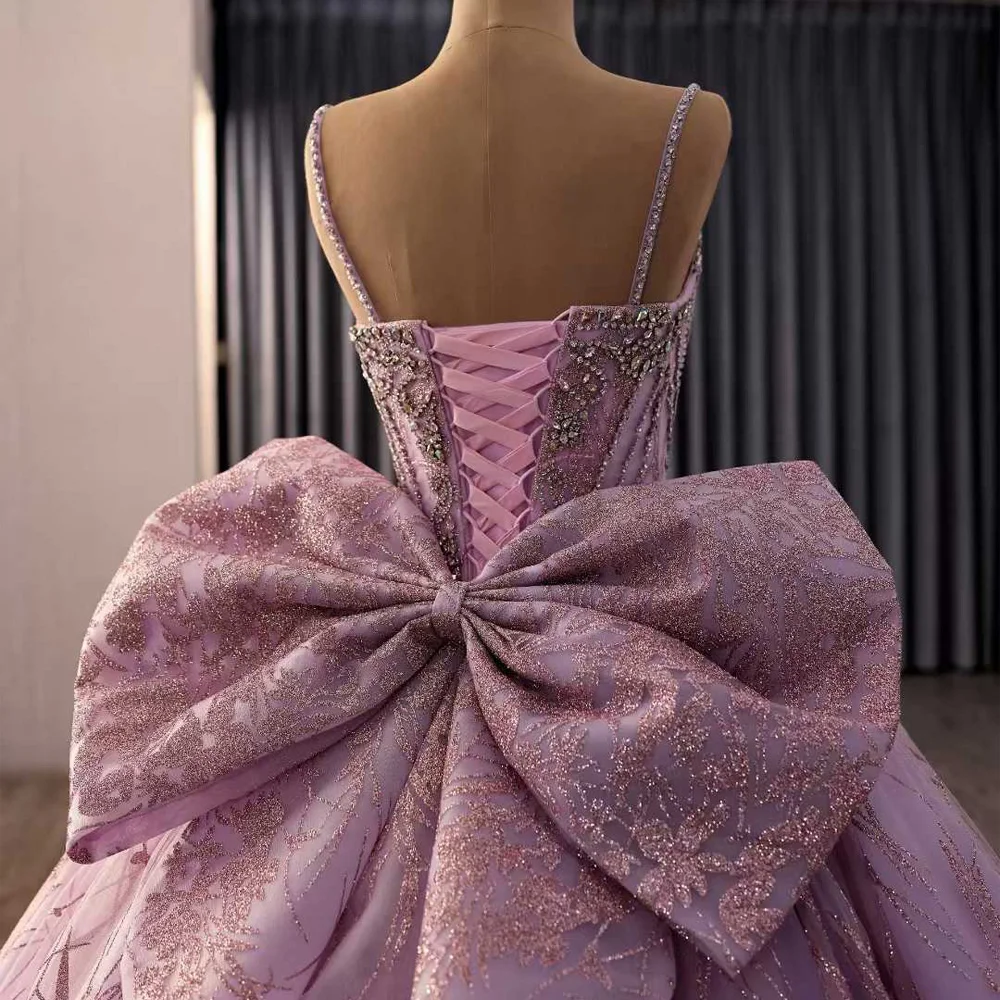 

Luxury Quinceanera Dress With Spaghetti Straps Lace Up Back Crystal Pearls Sequined Bow Floor Length Prom Dress