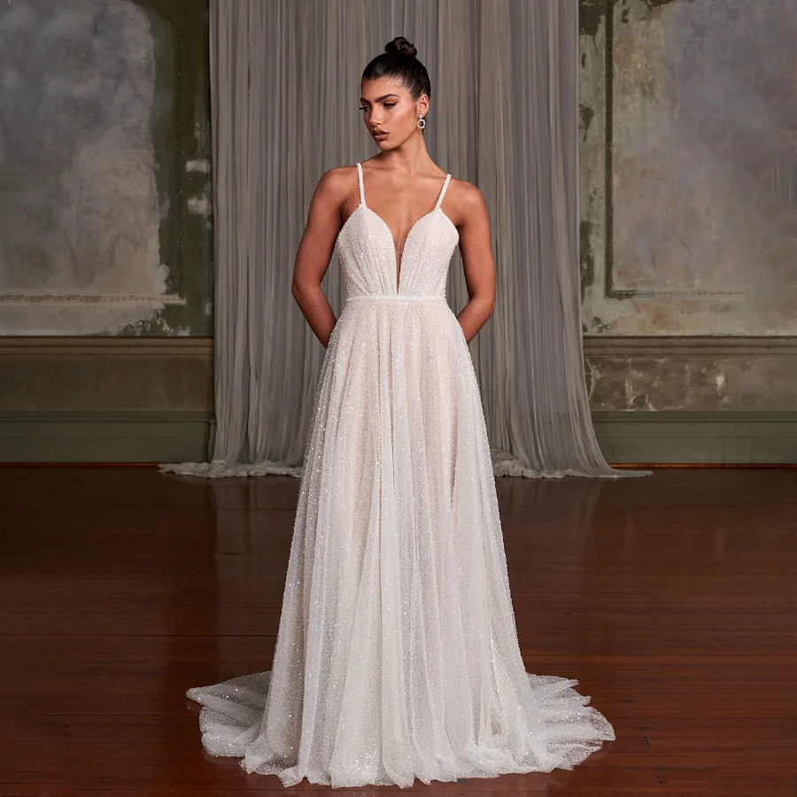 

Sparkling Sequin Wedding Dress with Spaghetti Straps Radiant V-Neckline Bridal Gown Adorned with Ethereal Watteau Train