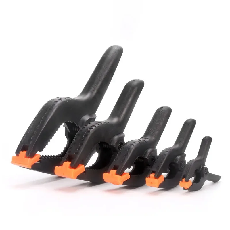 Pinces à ressort, outils de bricolage pour le travail du bois, pinces en plastique et Nylon pour le travail du bois, Clip à ressort, arrière-plan de Studio Photo