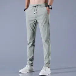Fashionable casual pants men's summer Korean version slim fit trend versatile ice silk sports pants solid color casual pants