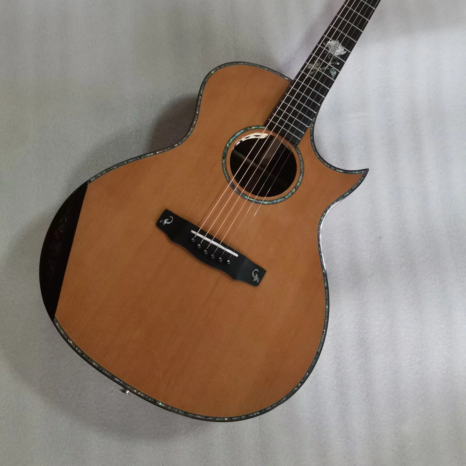 

The Rose Gold florence cutaway handmade walnut wood acoustic electric guitar only available in USA