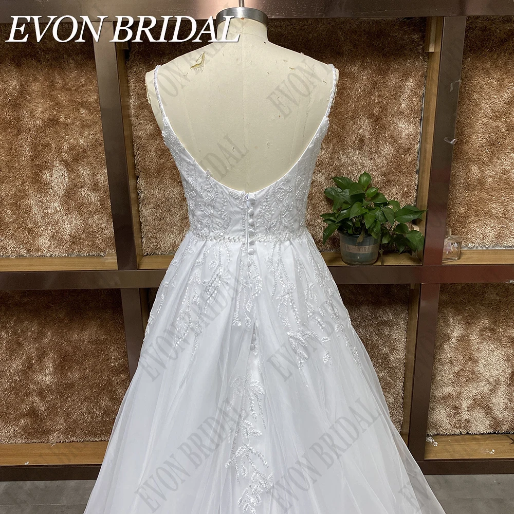 EVON BRIDAL 여성용 레이스 비즈 웨딩 드레스, 백리스 공주 드레스, 스파게티 스트랩, V넥 신부 가운, 2024 여성용 레이스 비즈 웨딩 드레스 백리스 프린세스 웨딩 드레스 스파게티 스트랩 브이넥 신부 가운 2024 우아한 A 라인 아플리케 실제 사진 플러스 사이즈 민소매 신부 드레스 스윕 트레인 맞춤 제작  레이스 진주 장식 여성 웨딩드레스 오프숄더 공주 원피스 스파게티 면 멜