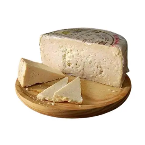 QUESO ROMERO OCAÑA para paladares exquisitos, graso, mantecoso, con pique, granuloso y quebradizo, color ocre, debido a su larga maduración de hasta 2 años