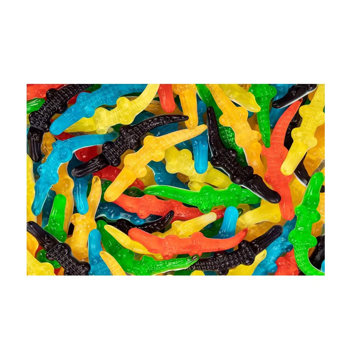HARIBO COCODRILO BRILLO COLORES 1KG son caramelos de goma en forma de lagartos de distintos colores y sabores que combinan gelatina con espuma. Sabor de Haribo TOP original calidad de confianza