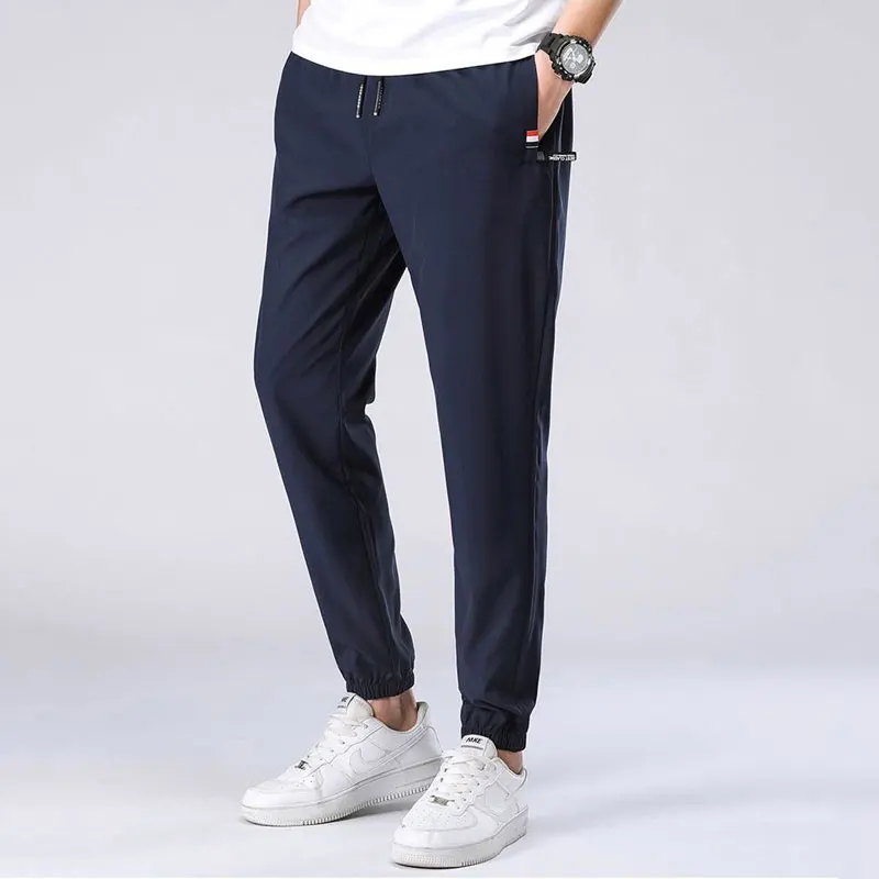 

New Fashion Summer Thin Section Men Sweatpants Casual Sports Breathing Pant Joggers Gyms Trousers Quick Dry Plus Size