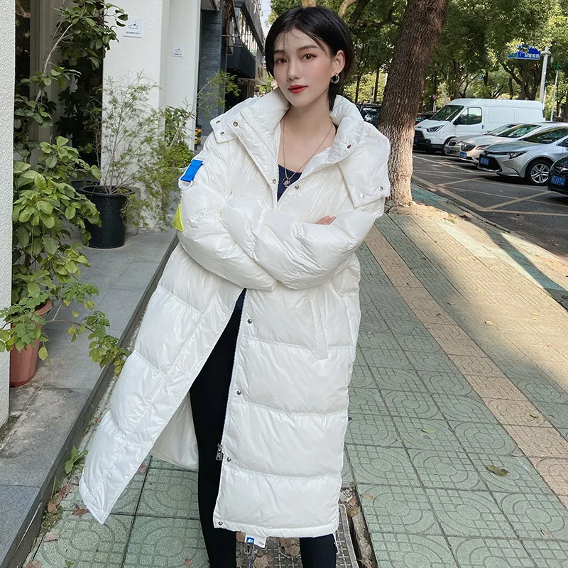 2021 Winter New Shiny Down Jacket Female Korean Version of White Duck Down Mid-length Over-the-knee Thickened Parka Coat In Snow