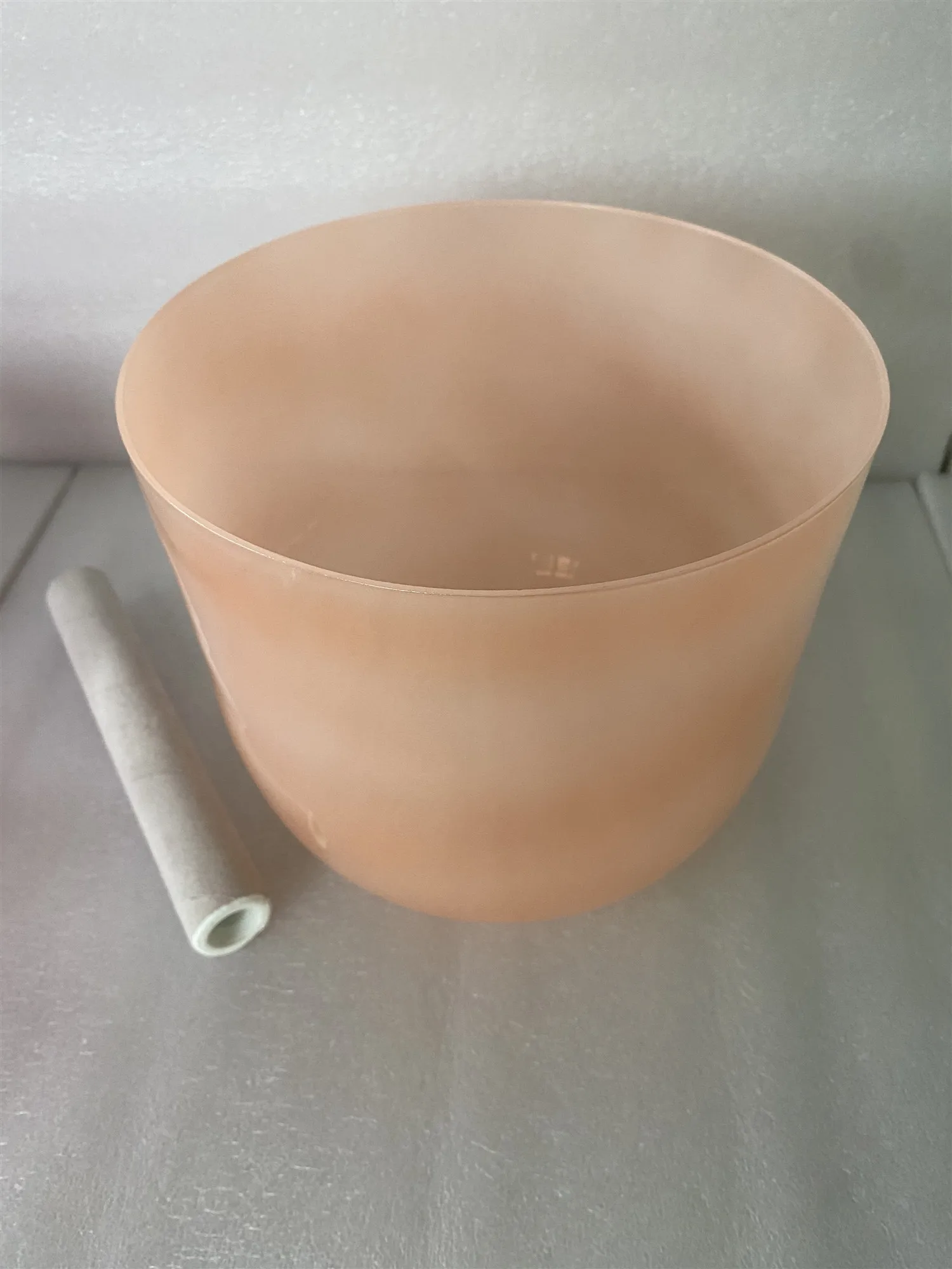 Crystal singing bowl orange pastel color 3rd octave D note sacral chakra 432Hz for sound healing.