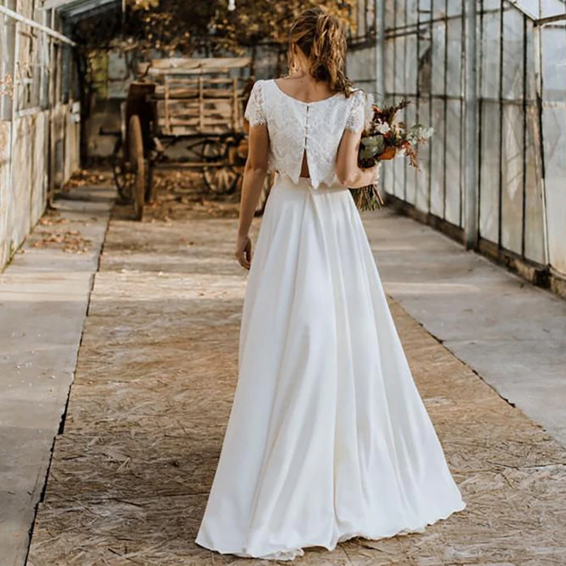 Vestidos de novia de encaje de dos piezas, cuello de Joya, manga corta, falda alta y baja, venta al por mayor, 2023