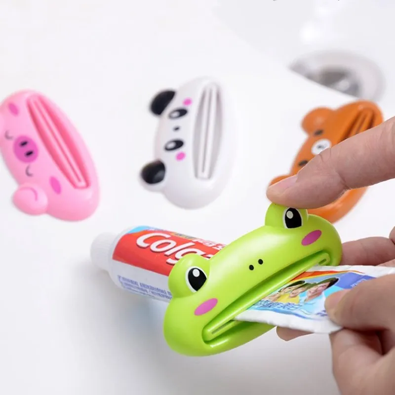 2 Pz/set Sveglio Creativo Del Fumetto di Plastica Facile Titolare Squeeze Tubetto di dentifricio Squeezer Rotolamento Pasta Set Da Bagno