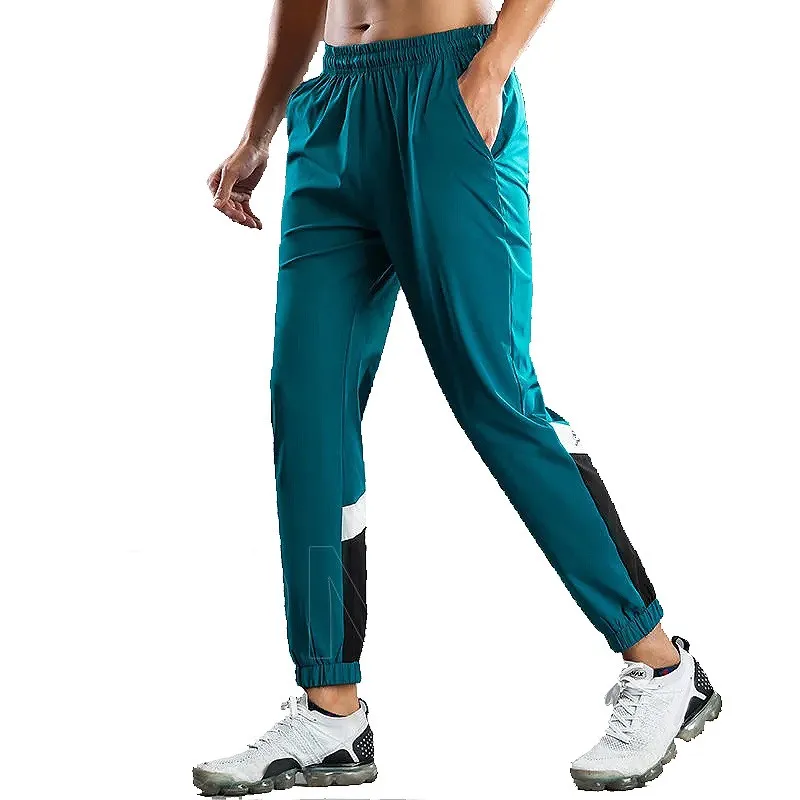 

High Elastic Jogging Pants Men Gym joggers Training Running Pants Workout Loose Speed Thin Dry Stitching color Leisure Fitness