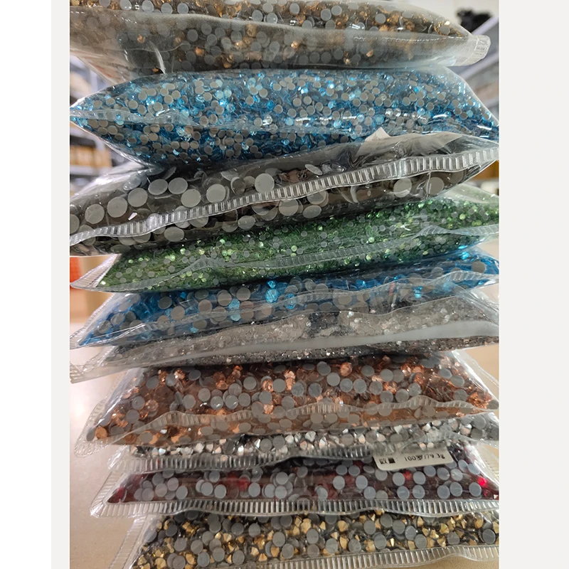 

Wholesales Hotfix Rhinestones Iron On High Quality Hot Fix Rhinestone Glass Crystal AB DIY Clothes