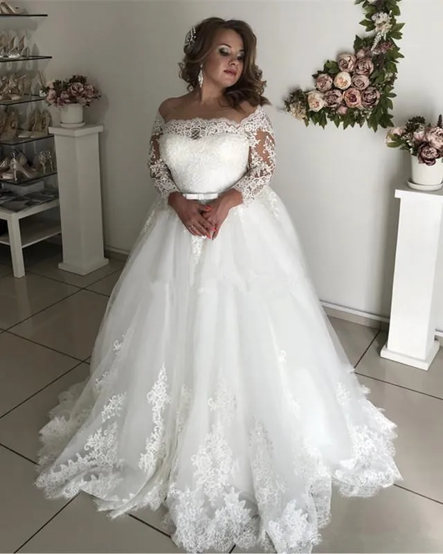 2025 Vestidos de novia de talla grande Cuello transparente Manga larga Encaje Espalda hueca Jardín País Vestidos de novia Robe De Mariage Personalizado