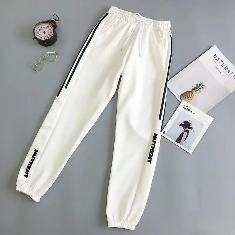 Pantalones de chándal holgados para Mujer, ropa de calle informal, pantalones Harem holgados negros, pantalones de tela suave Harajuku para Mujer