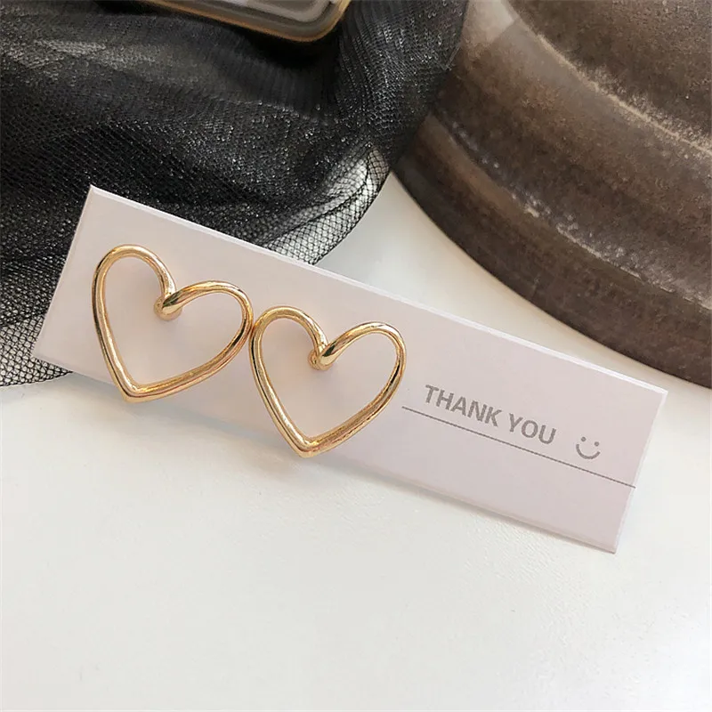 XIALUOKE Simple Metal Alloy Hollow Out Golden Heart Stud Earrings For Women New Fashion Jewelry Accessories ER066